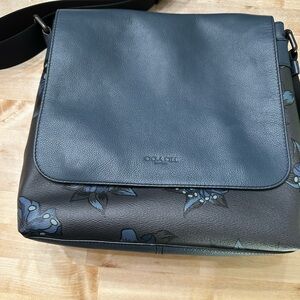 Authentic Brand new Coach Crossbody Navy Blue with flowers.